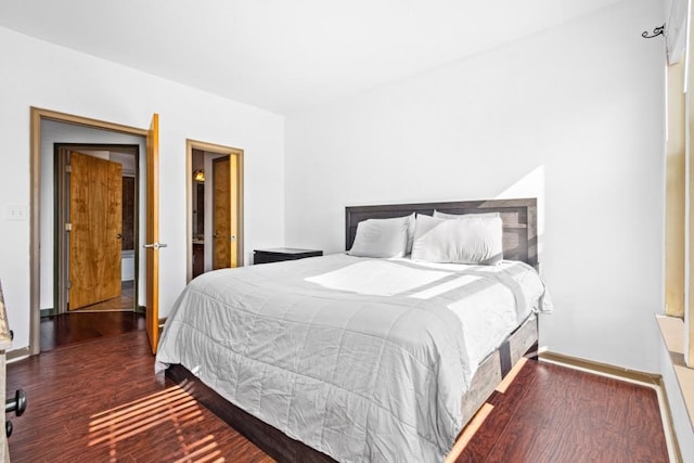 bedroom featuring dark wood-type flooring