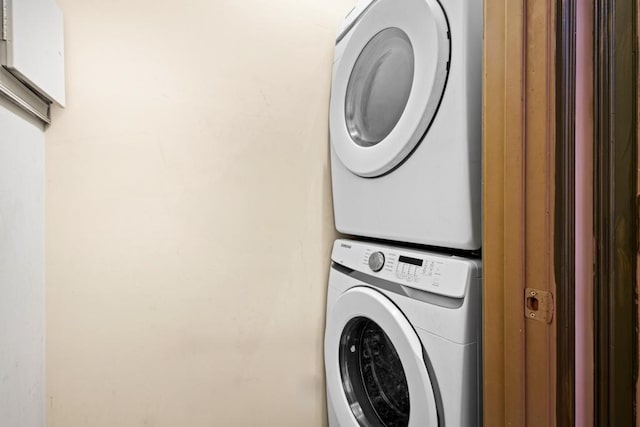 laundry area with stacked washer / dryer