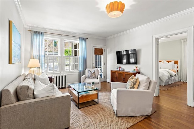 8 Collier Rd NW Unit A1, Atlanta, GA 30309 - living room with radiator, ornamental molding, and wood finished floors