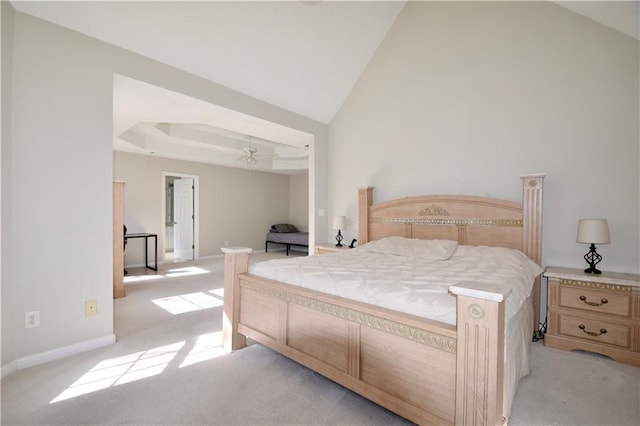 bedroom with baseboards, high vaulted ceiling, and light colored carpet