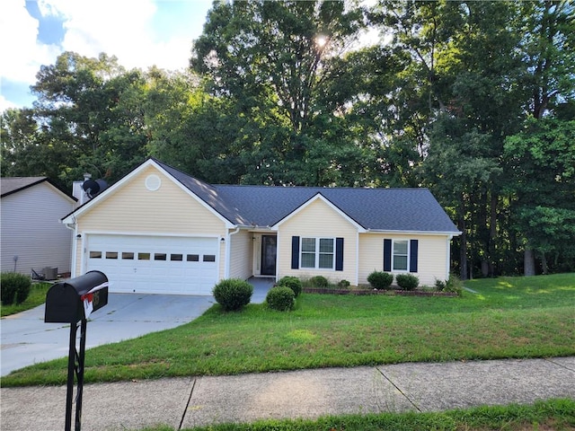 single story home featuring a front yard and a garage