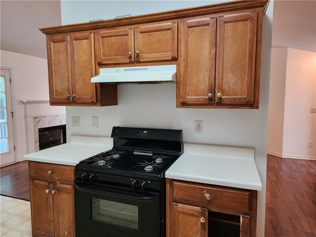 835 Amelia Grove Ln, Lawrenceville, GA 30045 - kitchen featuring black range with gas stovetop, under cabinet range hood, and brown cabinets