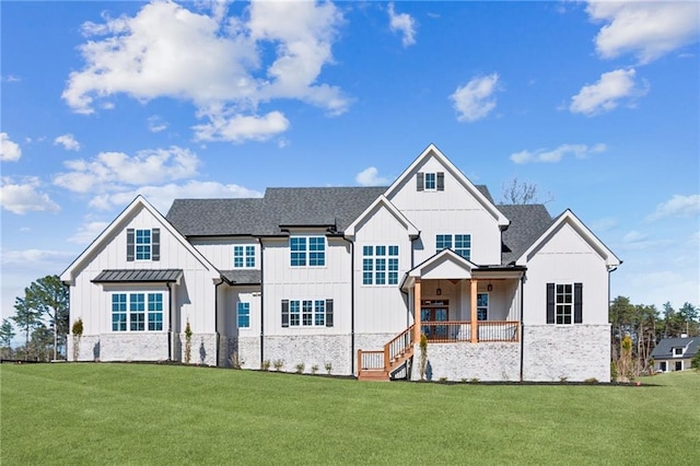 modern inspired farmhouse featuring a front lawn, board and batten siding, and roof with shingles