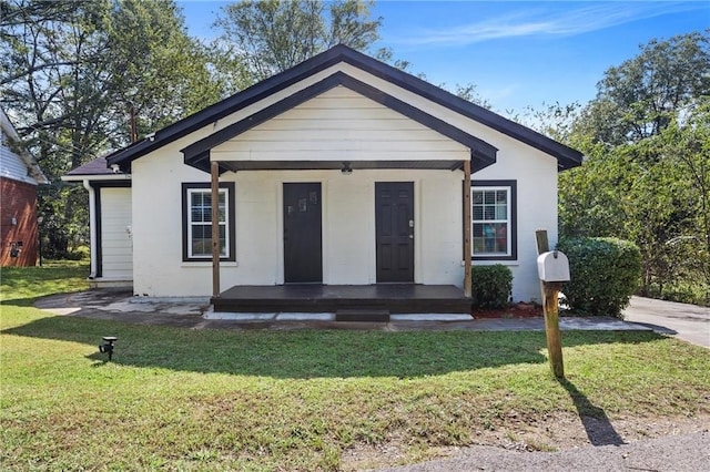 view of front of home with a front lawn and covered porch