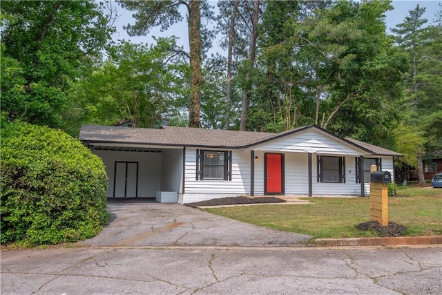 4922 Glenside Ct, Stone Mountain, GA 30088 - single story home with asphalt driveway, a front lawn, an attached carport, and a shingled roof