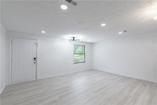4922 Glenside Ct, Stone Mountain, GA 30088 - spare room with a textured ceiling, light wood-type flooring, recessed lighting, and baseboards
