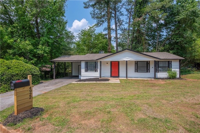 4922 Glenside Ct, Stone Mountain, GA 30088 - view of front facade with concrete driveway, a carport, a front lawn, and covered porch