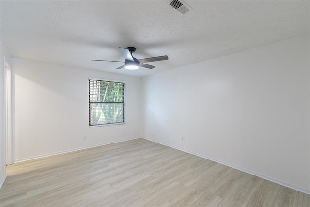 4922 Glenside Ct, Stone Mountain, GA 30088 - spare room with a ceiling fan, light wood-style floors, a textured ceiling, and baseboards