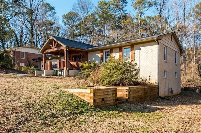 back of house with covered porch