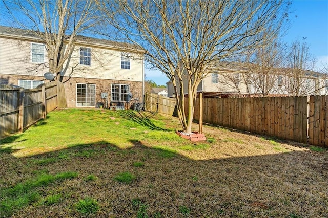 view of yard featuring a fenced backyard