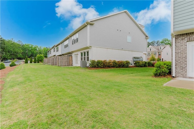 view of side of home featuring brick siding and cooling unit