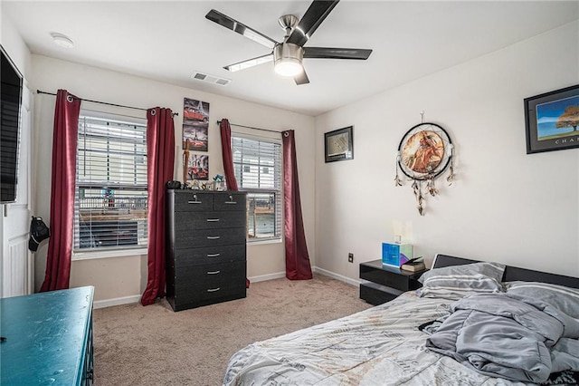 bedroom featuring ceiling fan and carpet floors