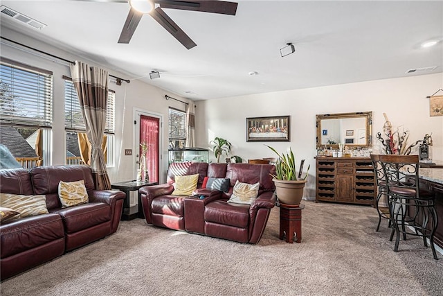 living room with carpet flooring and ceiling fan