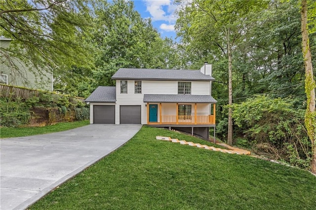 2599 Willow Creek Dr, Duluth, GA 30096 - view of front of property with a chimney, driveway, a front lawn, a porch, and an attached garage