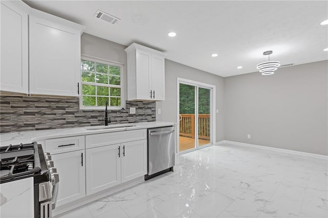 2599 Willow Creek Dr, Duluth, GA 30096 - kitchen featuring stainless steel appliances, a sink, light marble finish floors, recessed lighting, and white cabinetry