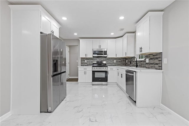 2599 Willow Creek Dr, Duluth, GA 30096 - kitchen with appliances with stainless steel finishes, baseboards, a sink, light marble finish floors, and recessed lighting