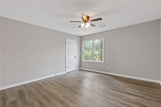 2599 Willow Creek Dr, Duluth, GA 30096 - empty room featuring wood finished floors, a ceiling fan, baseboards, and a textured ceiling
