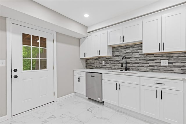 2599 Willow Creek Dr, Duluth, GA 30096 - kitchen with stainless steel dishwasher, a sink, light countertops, light marble finish floors, and white cabinets