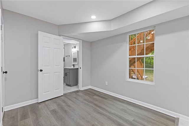2599 Willow Creek Dr, Duluth, GA 30096 - unfurnished bedroom with wood finished floors, baseboards, recessed lighting, and connected bathroom
