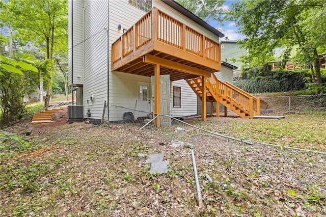 2599 Willow Creek Dr, Duluth, GA 30096 - back of property featuring a wooden deck, central AC, and stairway