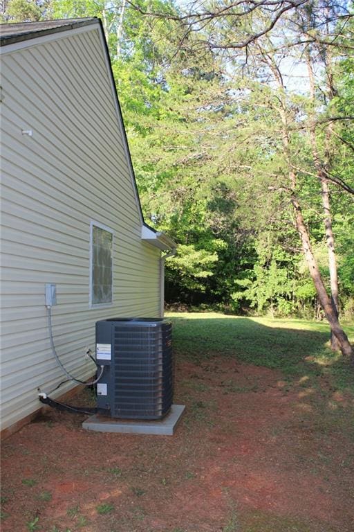 view of side of property with central AC unit