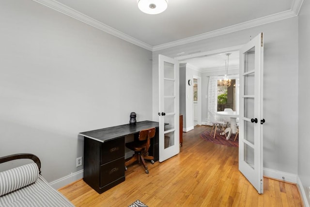 home office featuring french doors, light hardwood / wood-style floors, an inviting chandelier, and ornamental molding