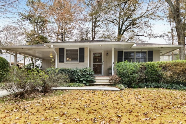 view of front of home with a carport