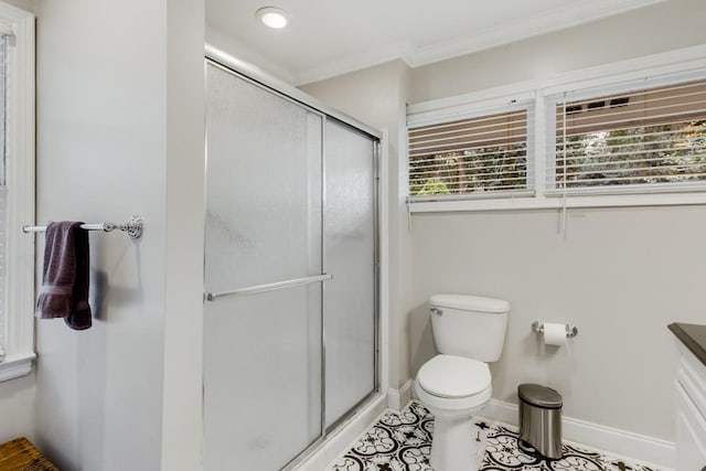 bathroom featuring toilet, crown molding, a shower with door, and tile patterned flooring