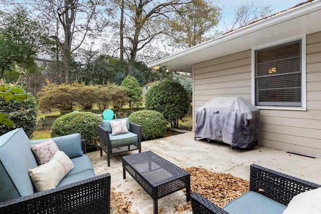 view of patio with a grill and an outdoor living space