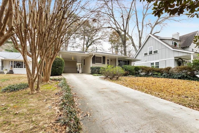 view of front of property featuring a carport