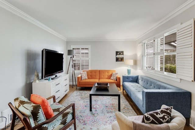 living room featuring light hardwood / wood-style floors and ornamental molding