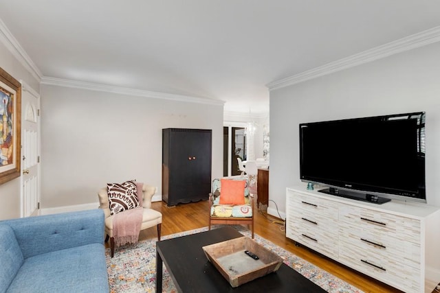 living room featuring hardwood / wood-style floors and crown molding