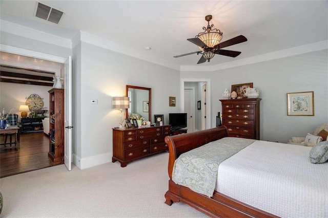 bedroom featuring ornamental molding, light carpet, baseboards, and ceiling fan