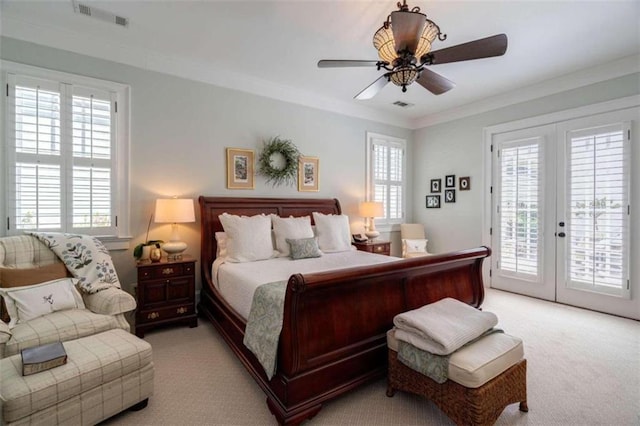 bedroom featuring light carpet, access to exterior, french doors, ornamental molding, and a ceiling fan