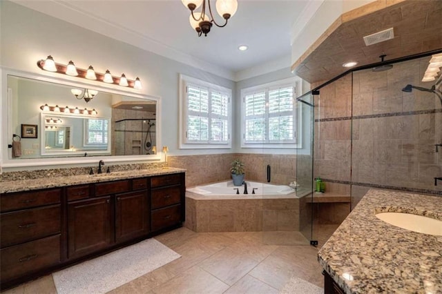 full bathroom featuring plenty of natural light, two vanities, a stall shower, crown molding, and recessed lighting