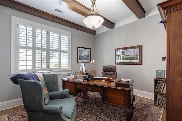 home office with baseboards, beamed ceiling, and wood finished floors