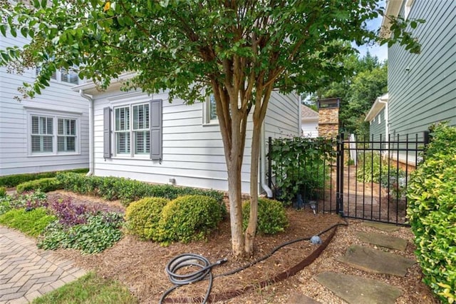 view of property exterior with fence