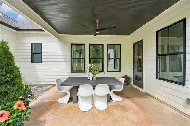 view of patio featuring outdoor dining area and ceiling fan