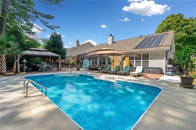 view of pool with a gazebo and a patio area