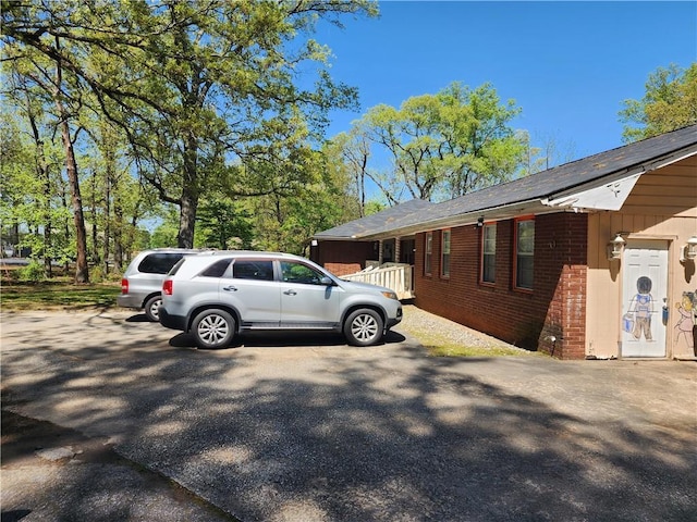 view of side of property with brick siding