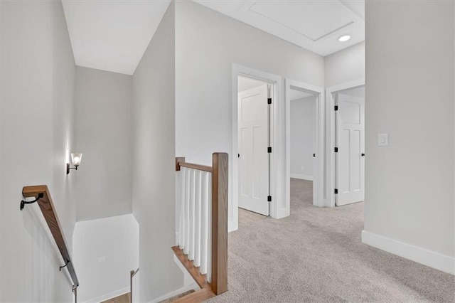 hallway with light colored carpet