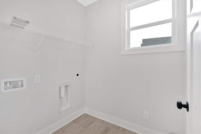 laundry area with hookup for a washing machine and hookup for an electric dryer