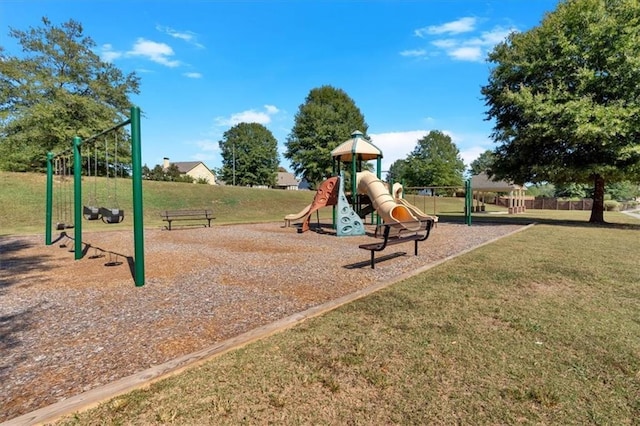 view of playground with a lawn