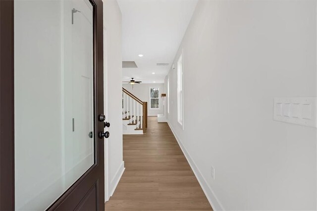 hallway featuring light hardwood / wood-style flooring