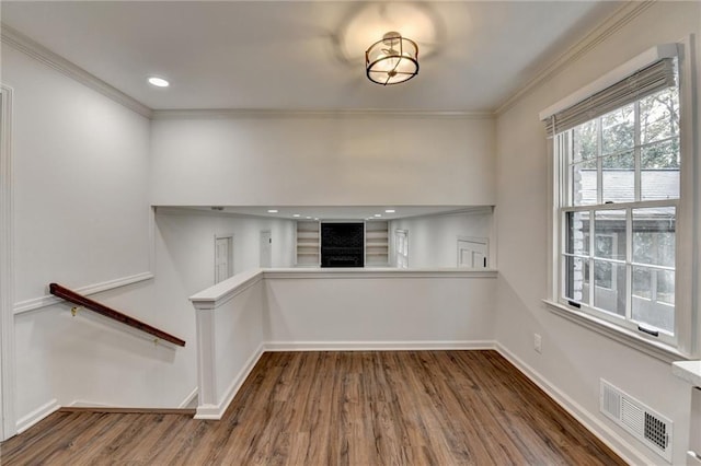 interior space featuring dark hardwood / wood-style floors and ornamental molding