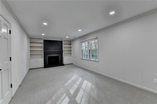 unfurnished living room featuring light colored carpet, built in shelves, ornamental molding, and a fireplace