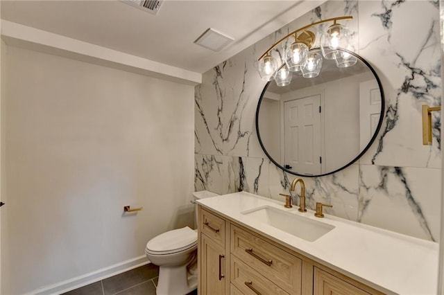 bathroom featuring tile walls, toilet, tile patterned flooring, and vanity