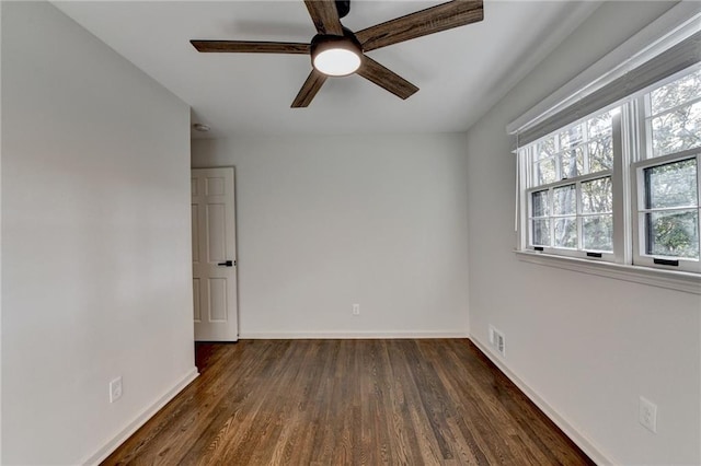 unfurnished room featuring ceiling fan and dark hardwood / wood-style flooring