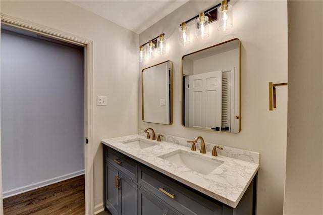 bathroom featuring hardwood / wood-style flooring and vanity