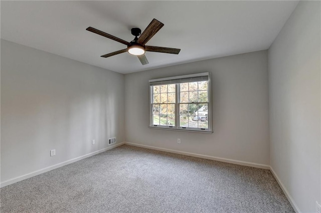 empty room with carpet flooring and ceiling fan